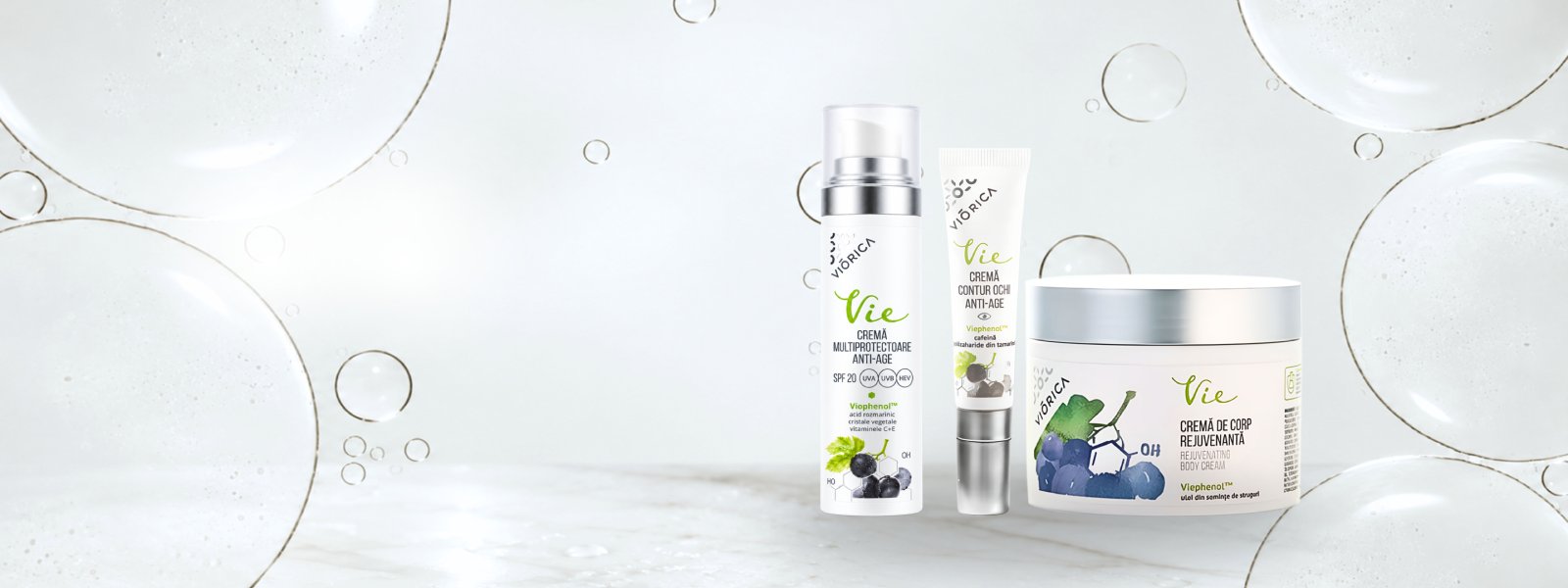 Viorica VIE näokreem SPF 20, silmaümbruskreem ja kehakreem heledal mullidega taustal.